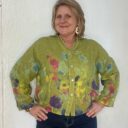 Lady showing floral print detail on Italian Linen button front top.